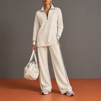 Delfina: completo avorio con tunica a mezza zip, spacchi laterali e pantaloni palazzo.